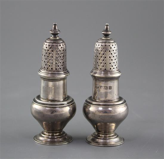 A pair of George V silver baluster pepperettes by S.W. Smith & Co, Birmingham, 1919, height 10.1cm, weight 3.5oz.